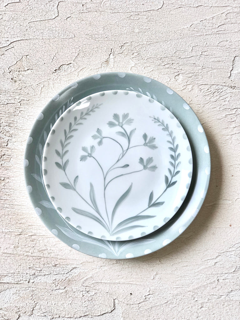 white salad plate with green hand painted floral design 10.5 inch stacked top view