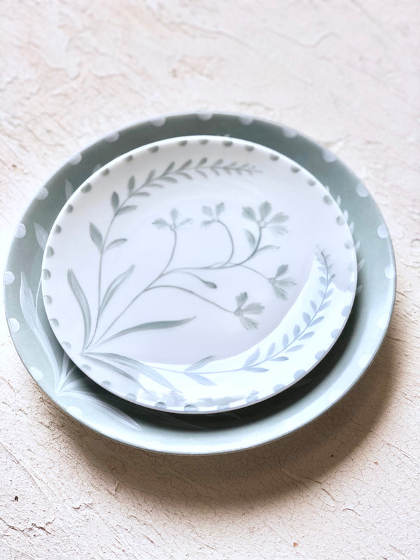 white dinner plate with sage green floral design 10.5 inch stacked