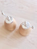 wood salt and pepper mills with silver top close up