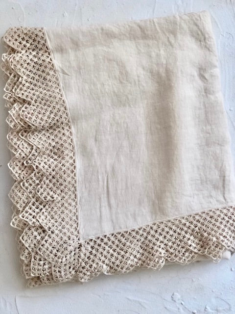 cream linen tablecloth with macrame trim detail view
