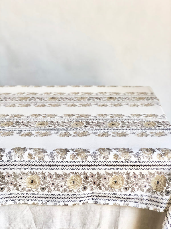 tablecloth in floral pattern by d'ascoli in taupe side view