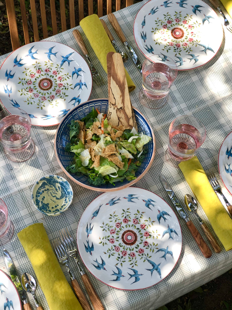 spalted maple wood salad servers shown in a salad bowl on table setting
