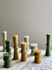 assorted small green totem candles