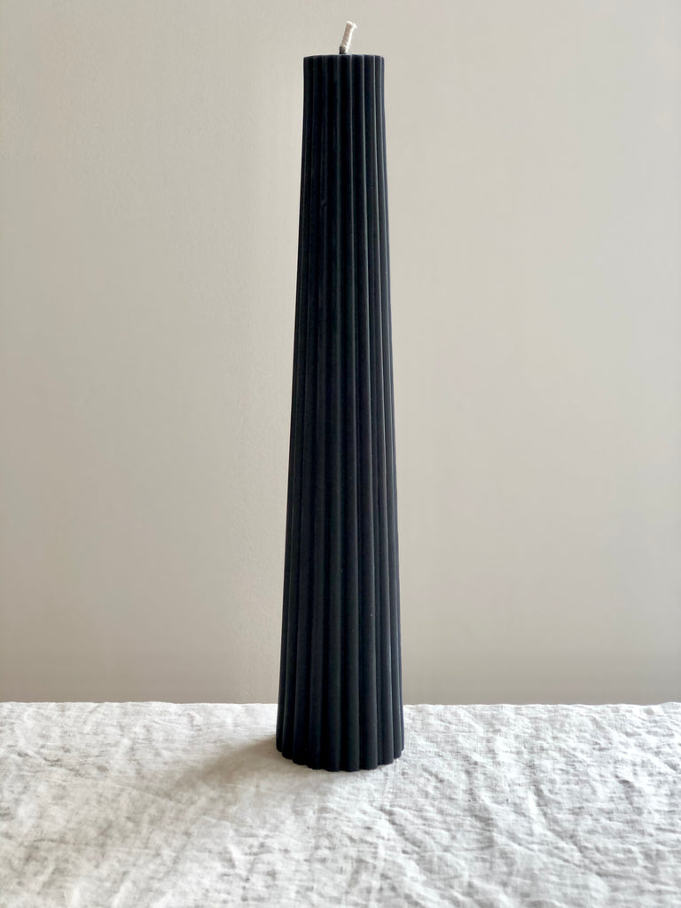 fluted black pillar candle made of beeswax