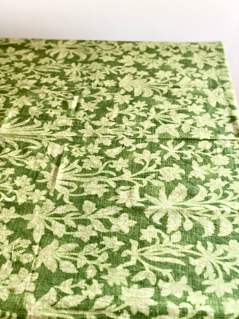 floral tablecoth by d'ascoli in fern color laid flat