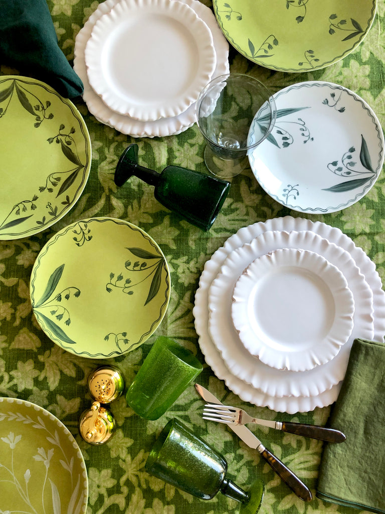 floral tablecoth by d'ascoli in fern color with grouping of dishes