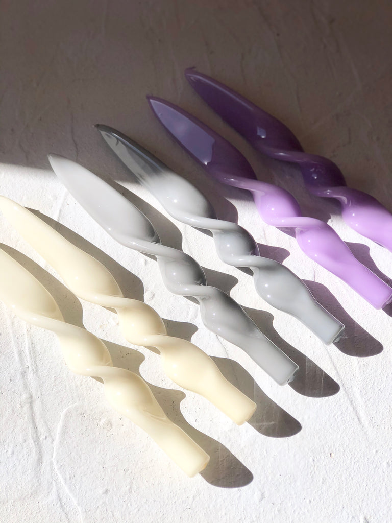 cream twisted taper candles 11" on white table