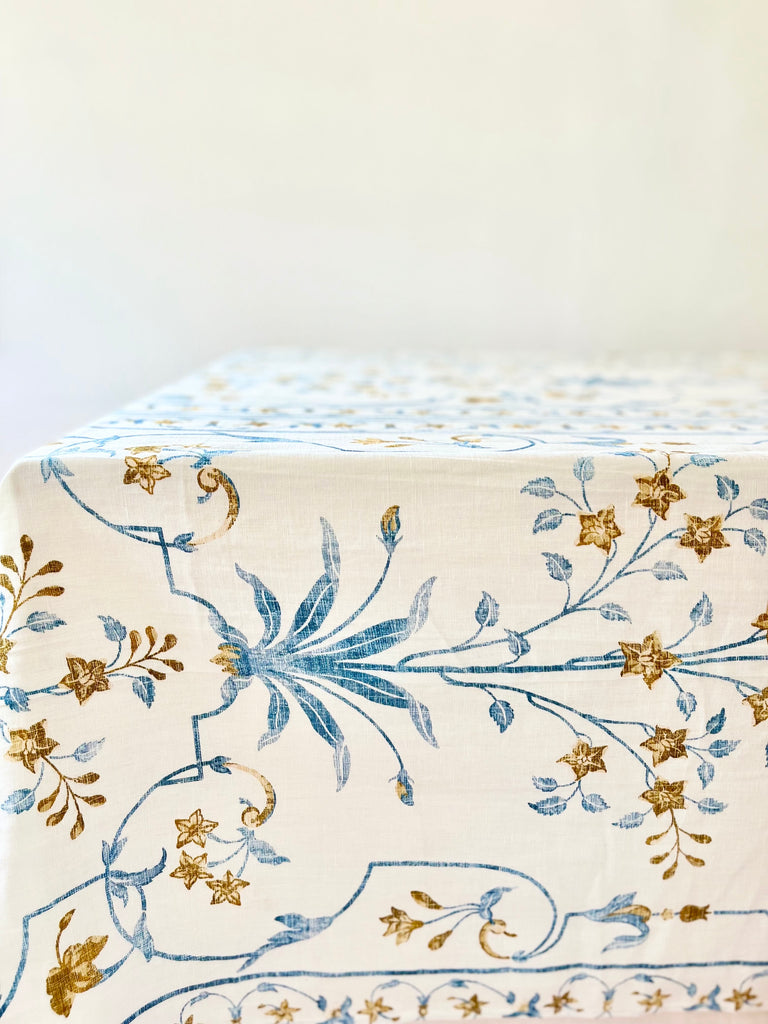 white tablecloth with blue and brown floral pattern