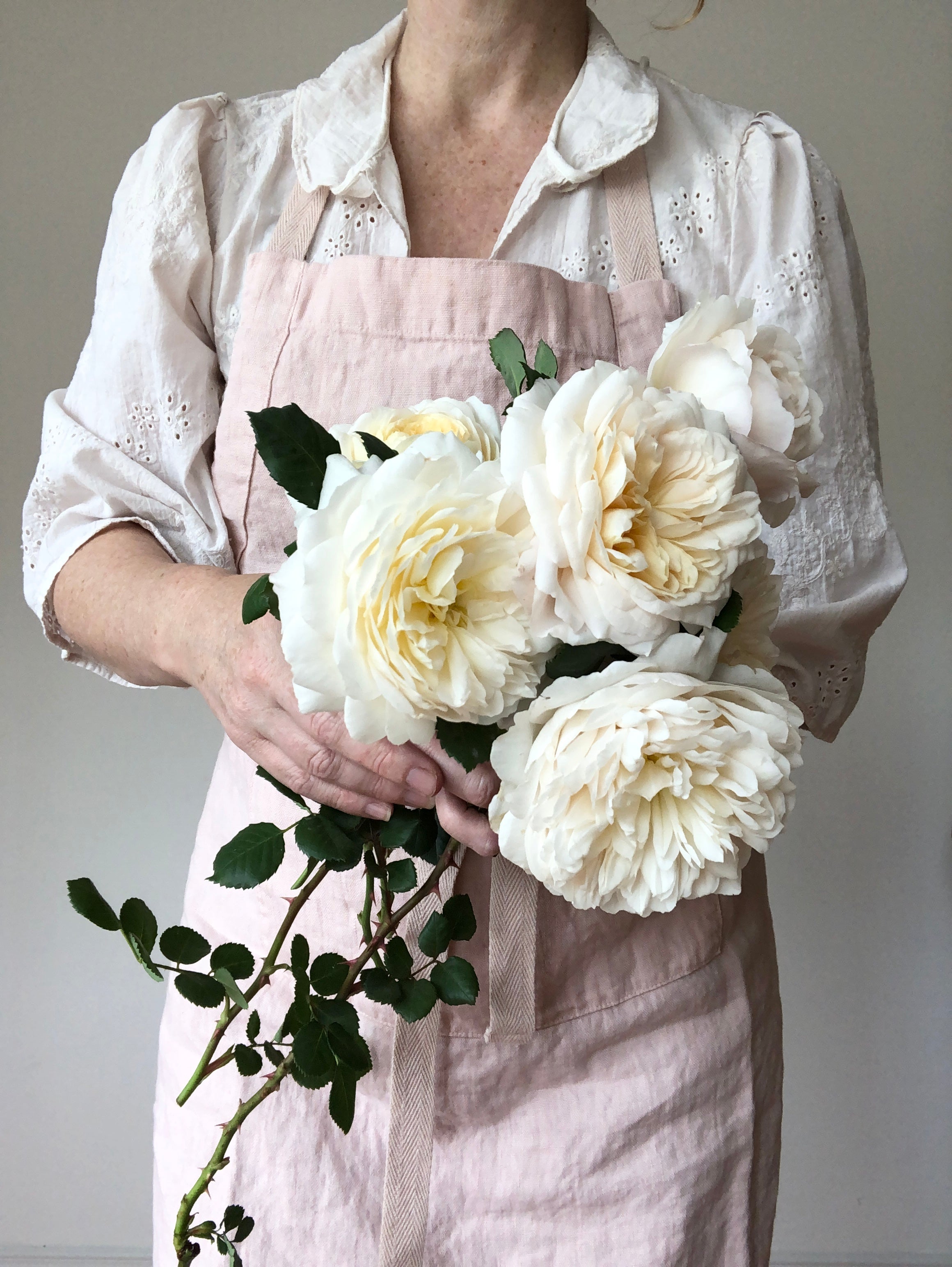 light pink linen apron full length with flowers