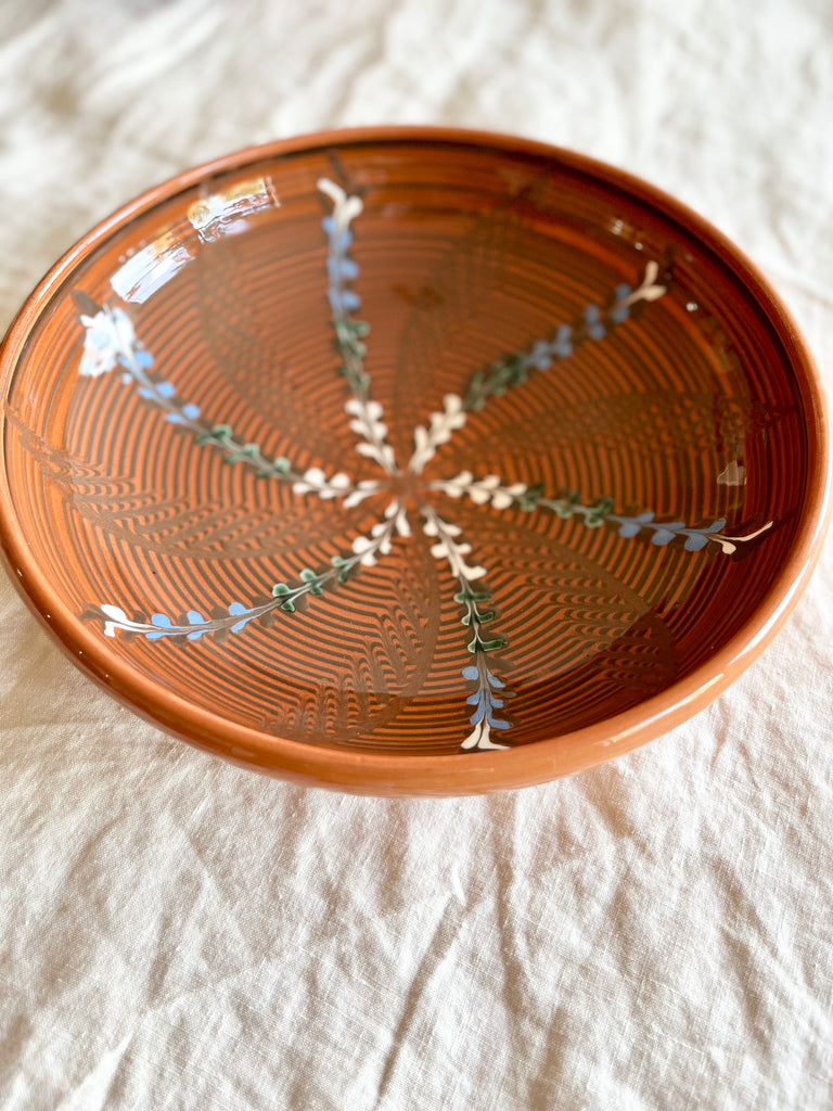 ceramic pasta bowl in henna with radial leaf design detail view