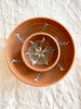 ceramic pasta bowl in henna with radial leaf design nested