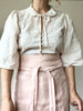 light pink linen apron bistro style waist detail view