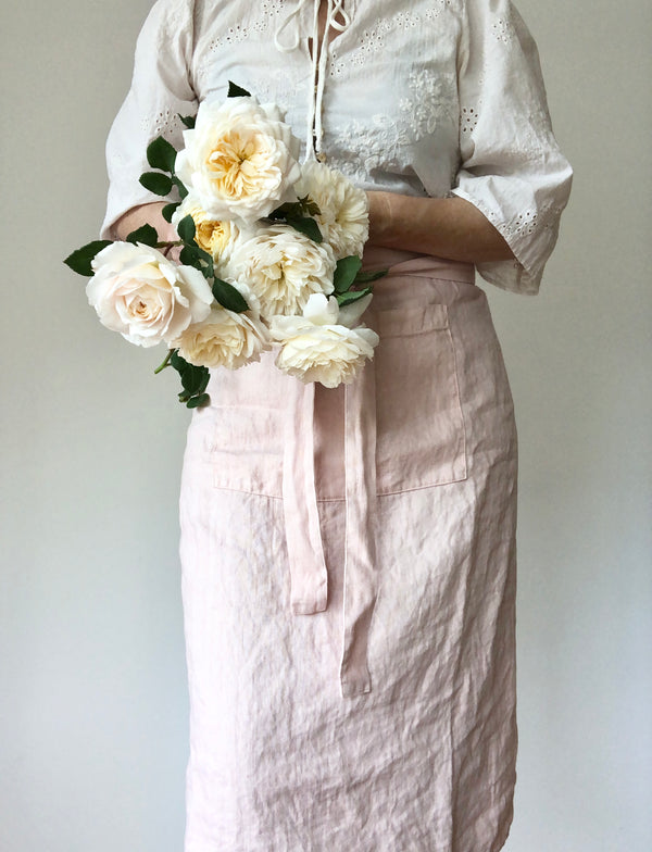 light pink linen apron bistro style with flowers