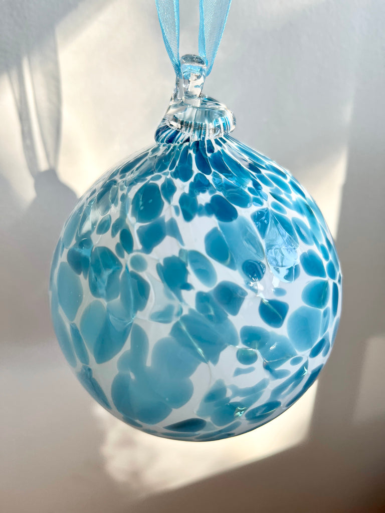 hand blown glass ornament with blue speckles