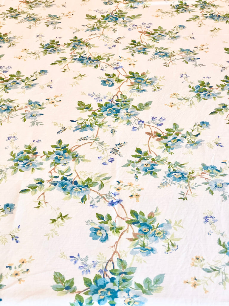 white tablecloth with blue floral pattern detail view