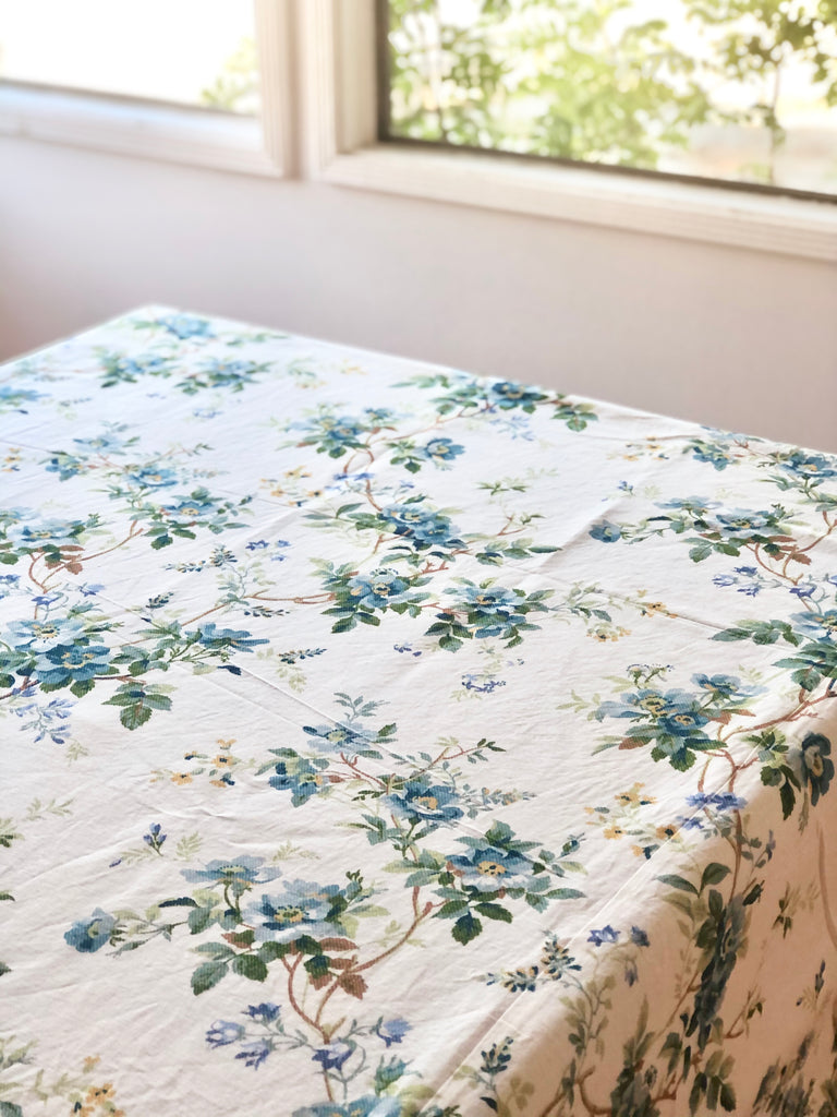 white tablecloth with blue floral pattern on table