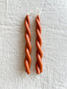 twisted candles by wax atelier in blood orange tapers
