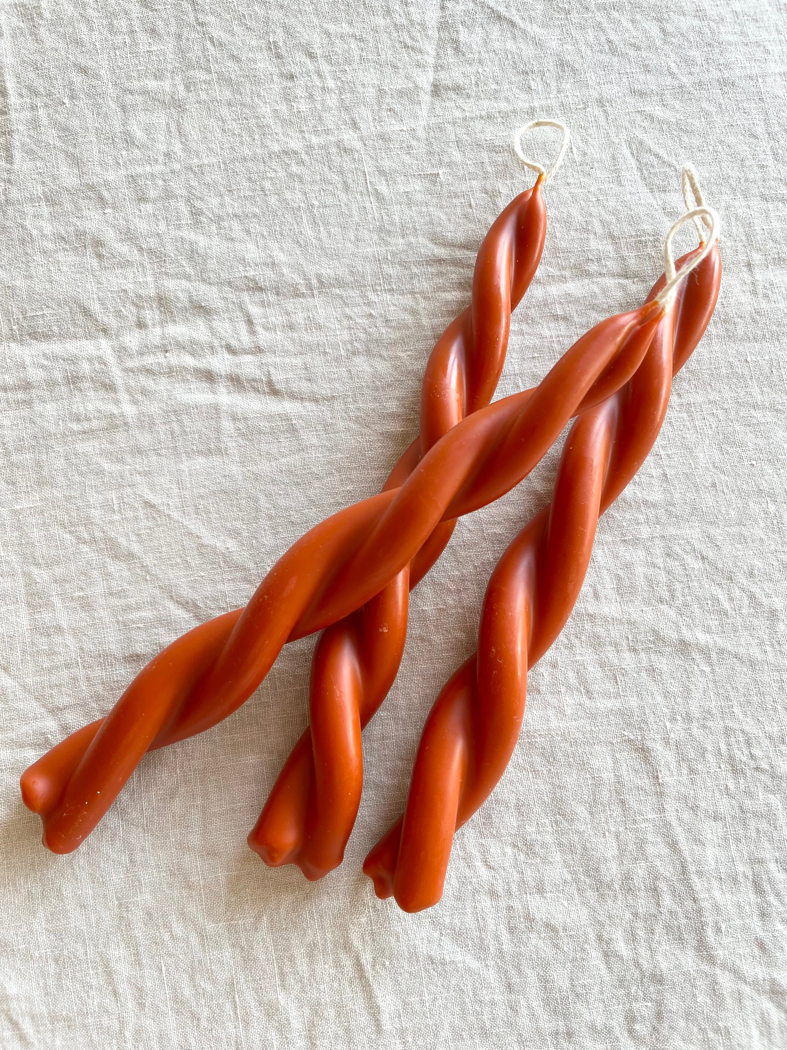 twisted candles by wax atelier tapers on white table