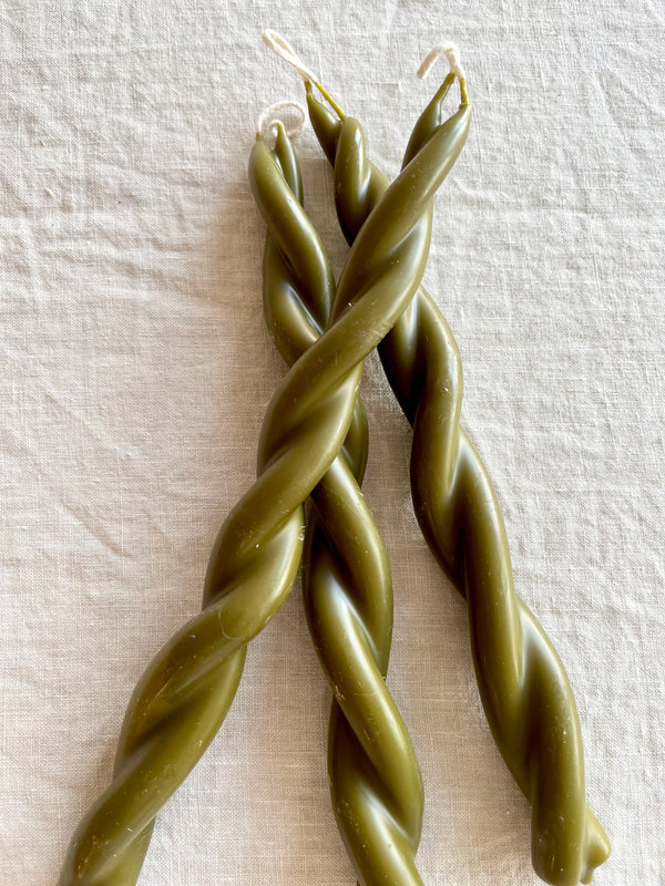 moss green twisted taper candles by wax atelier in group of three