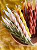 assorted colors of hand-crafted twist taper candles