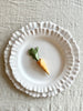 carrot shaped ceramic knife rest detail on white plate 2.5 inches long