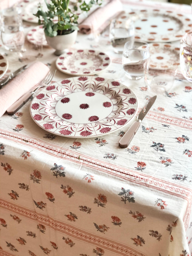 white tablecloth with red pinstripe and red floral pattern angled view