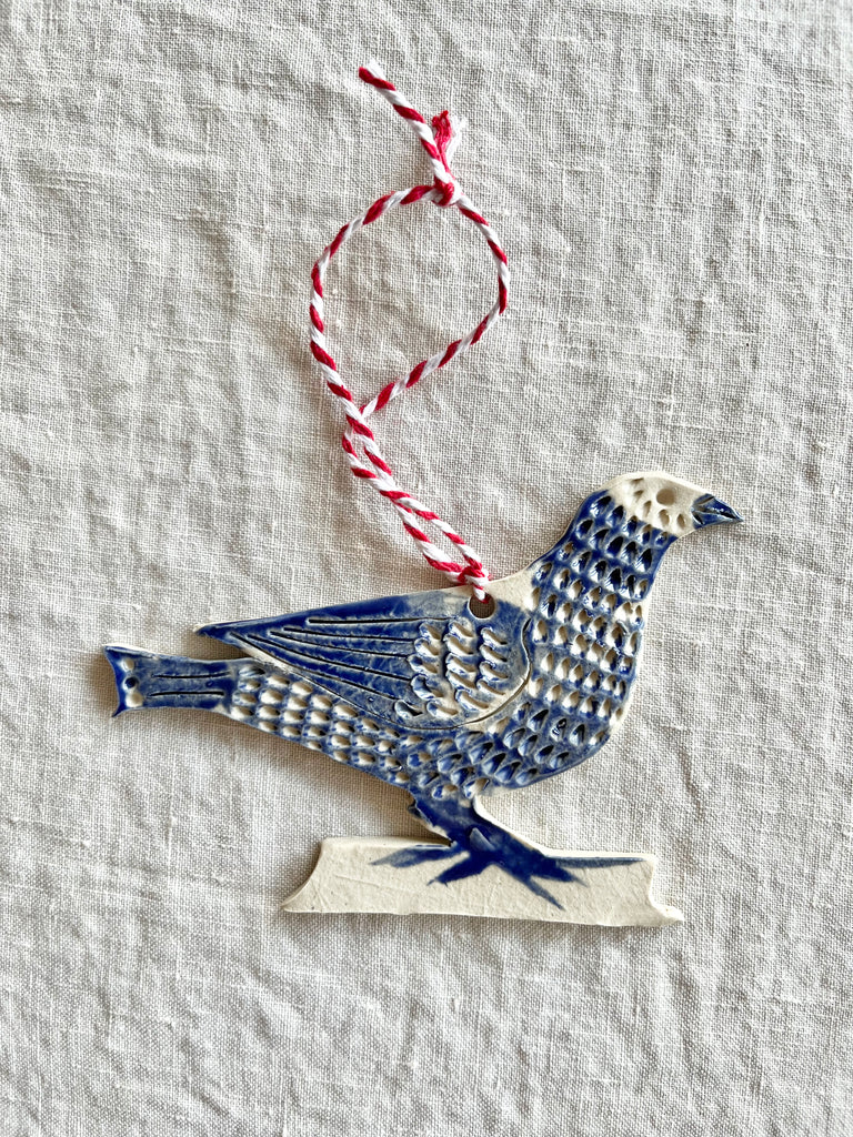 hand painted blue and white bird christmas ornament detail view