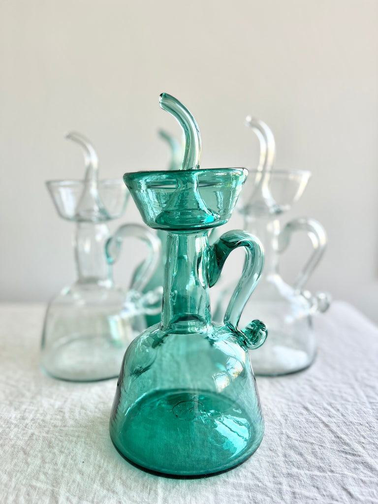 green blown glass cruet by gordiola in group of four