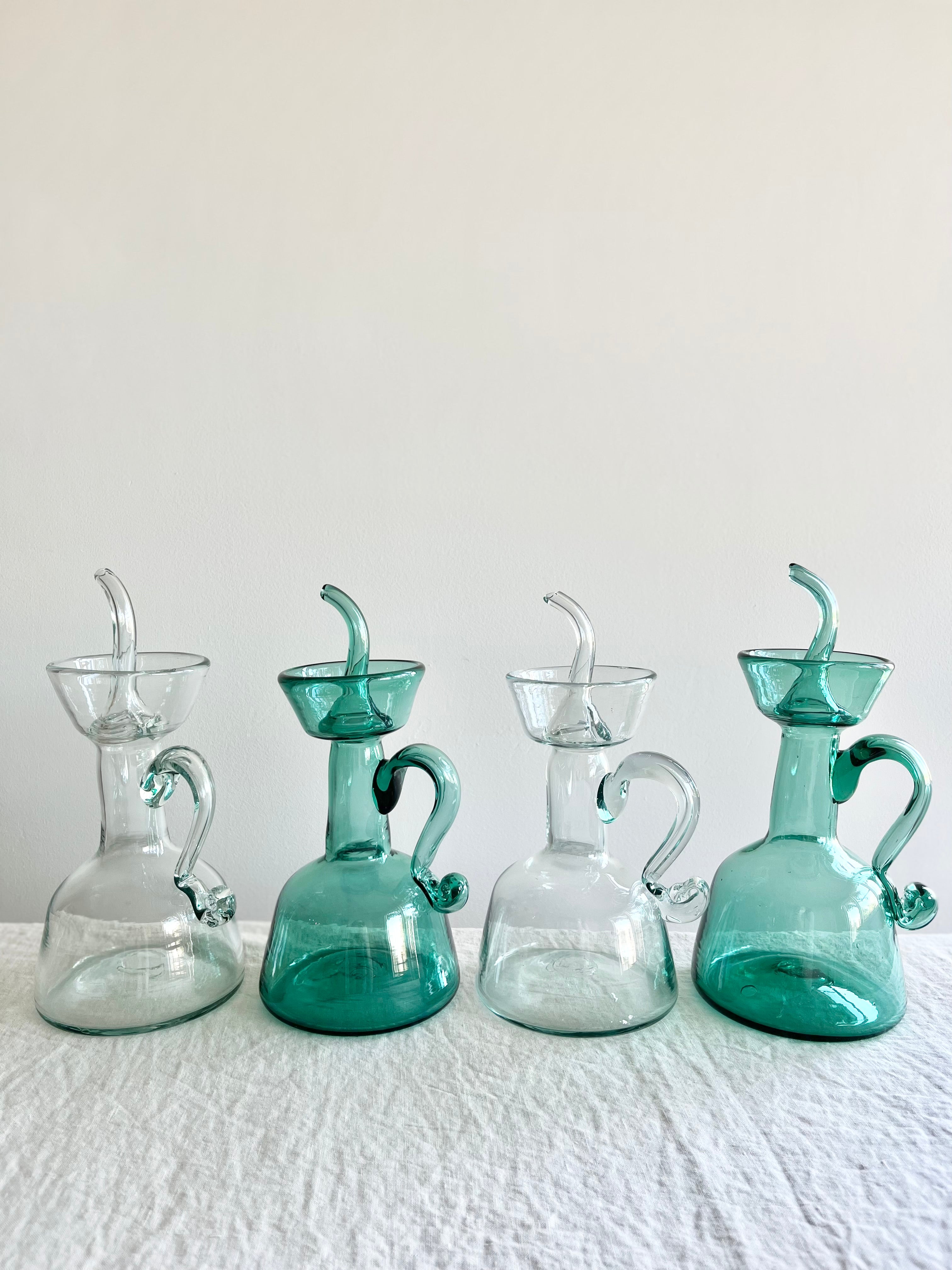 clear blown glass cruet by gordiola in group of four