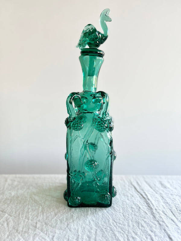 rectangular green glass bottle with stopper 15 inches tall