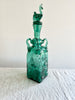rectangular green glass bottle with stopper 12.5 inches tall angled view