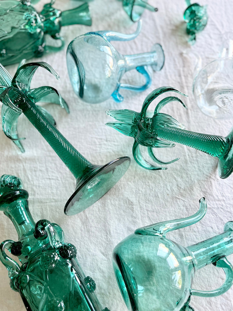 blown glass cruet by gordiola in green on linen tablecloth