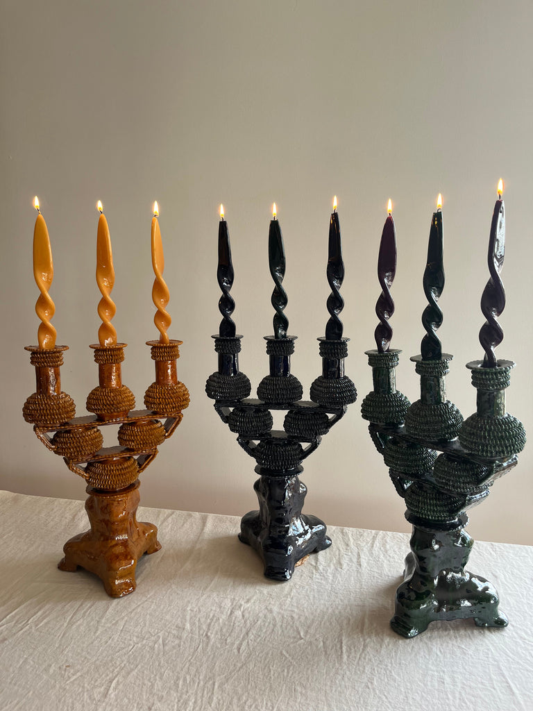 blue ceramic candelabra 17.5 inch assorted colors displayed with flame lit