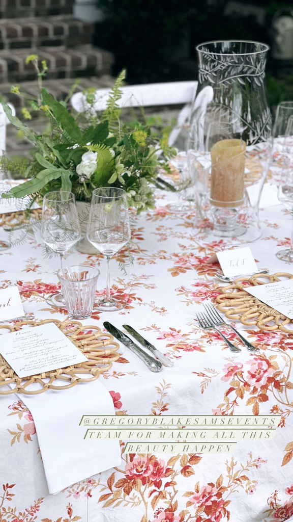 linen tablecloth with red climbing rose pattern with crystal glasses