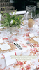 linen tablecloth with red climbing rose pattern with crystal glasses