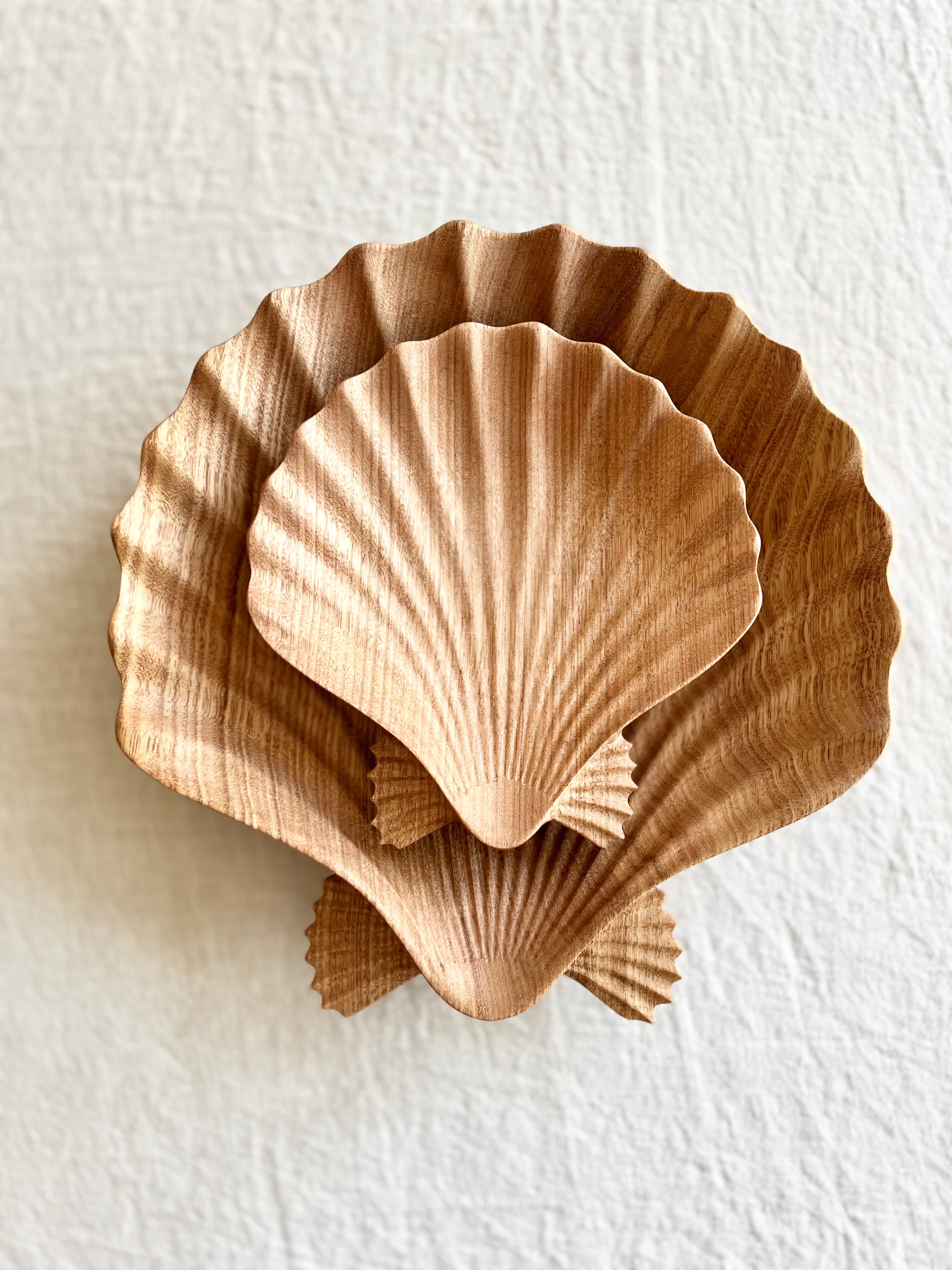 small wooden bowl with scalloped edge 6.25 inches on white table