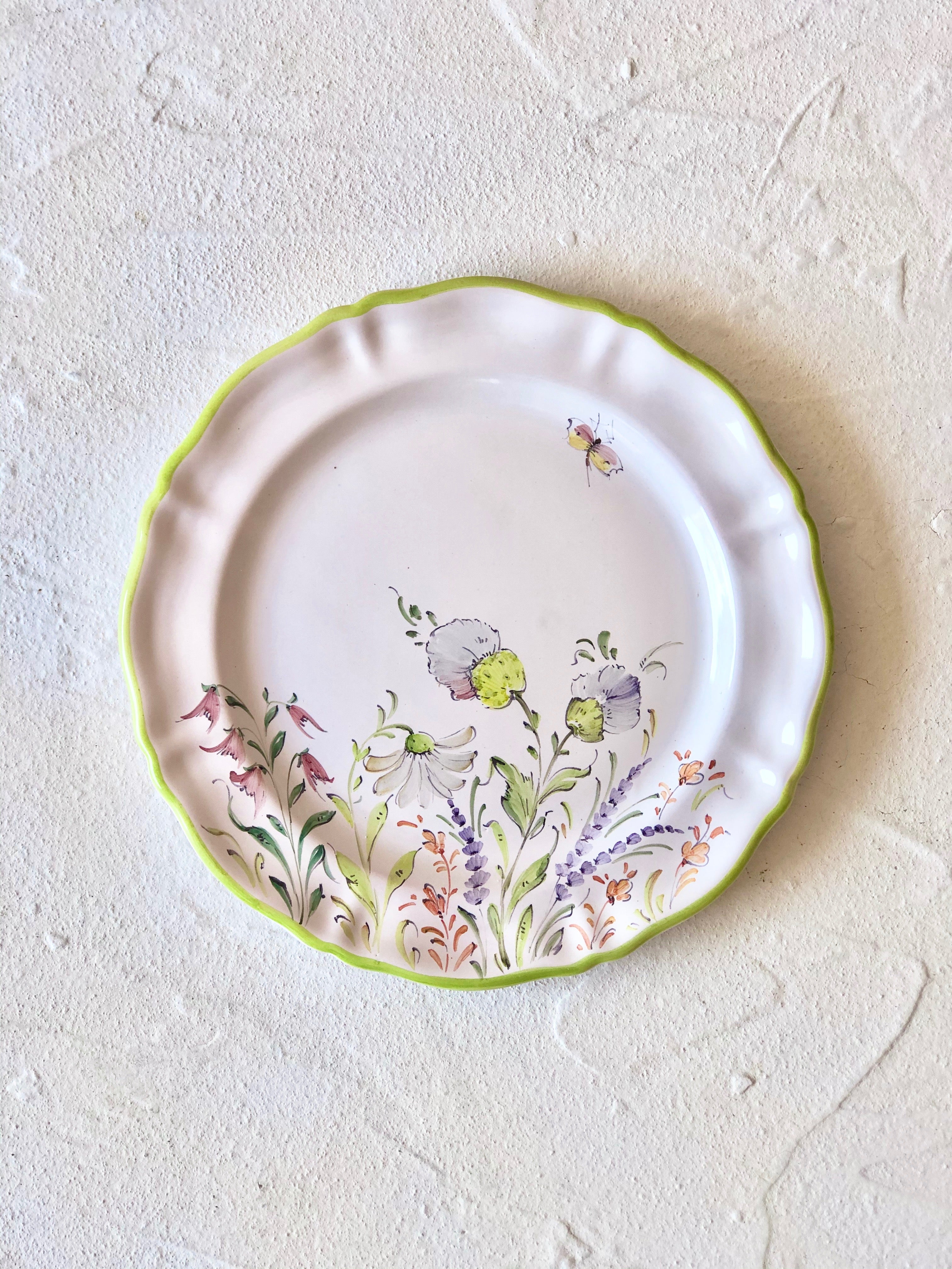 flower salad plates with green edge on cream table