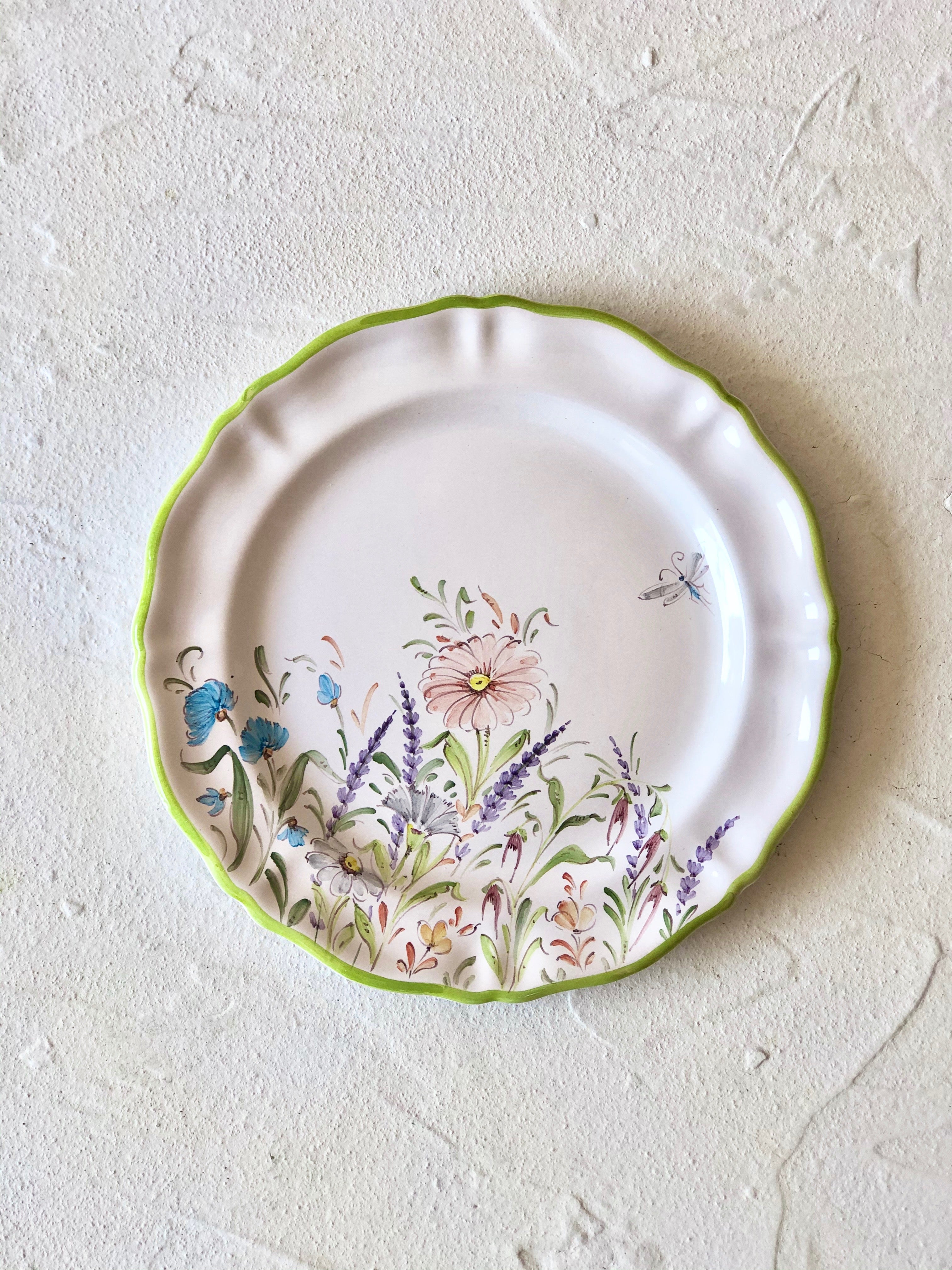 flower salad plates with green edge close up