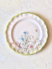flower salad plates with green edge on white table
