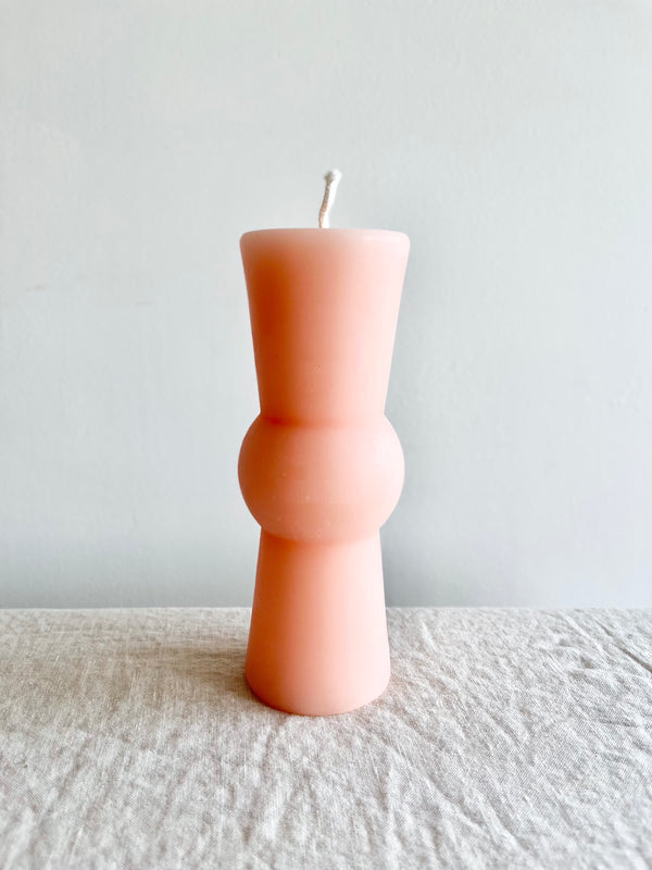 light pink peony totem candle medium size on table
