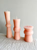 light pink peony totem candles small medium and large on table
