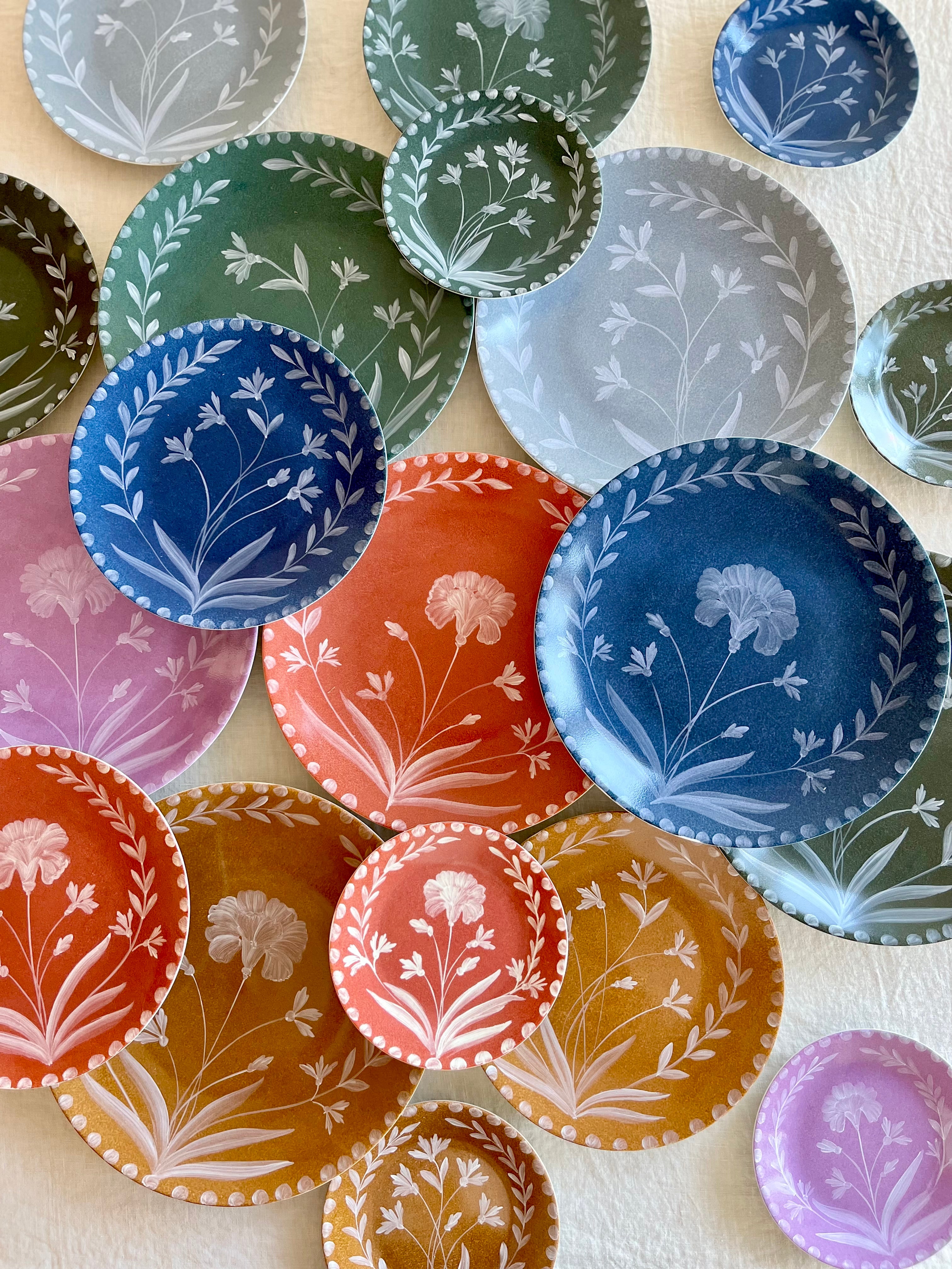 blue salad plate with hand painted white floral design with other color options