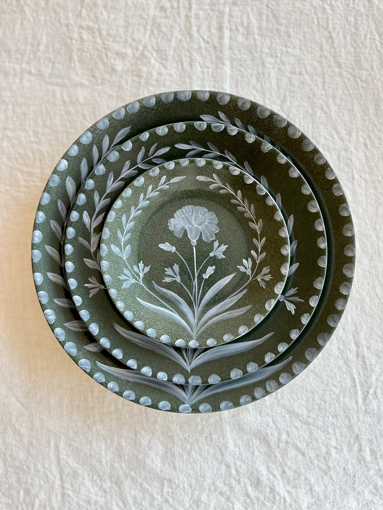dark green limoges porecelain salad plate with hand painted white floral design with bread and dinner plates