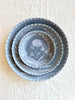 blue salad plate with white floral pattern with dinner plate