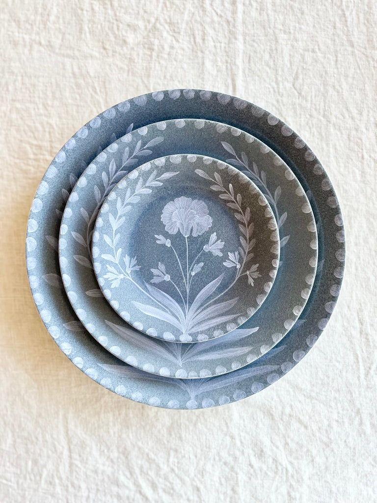 blue salad plate with white floral pattern with dinner plate