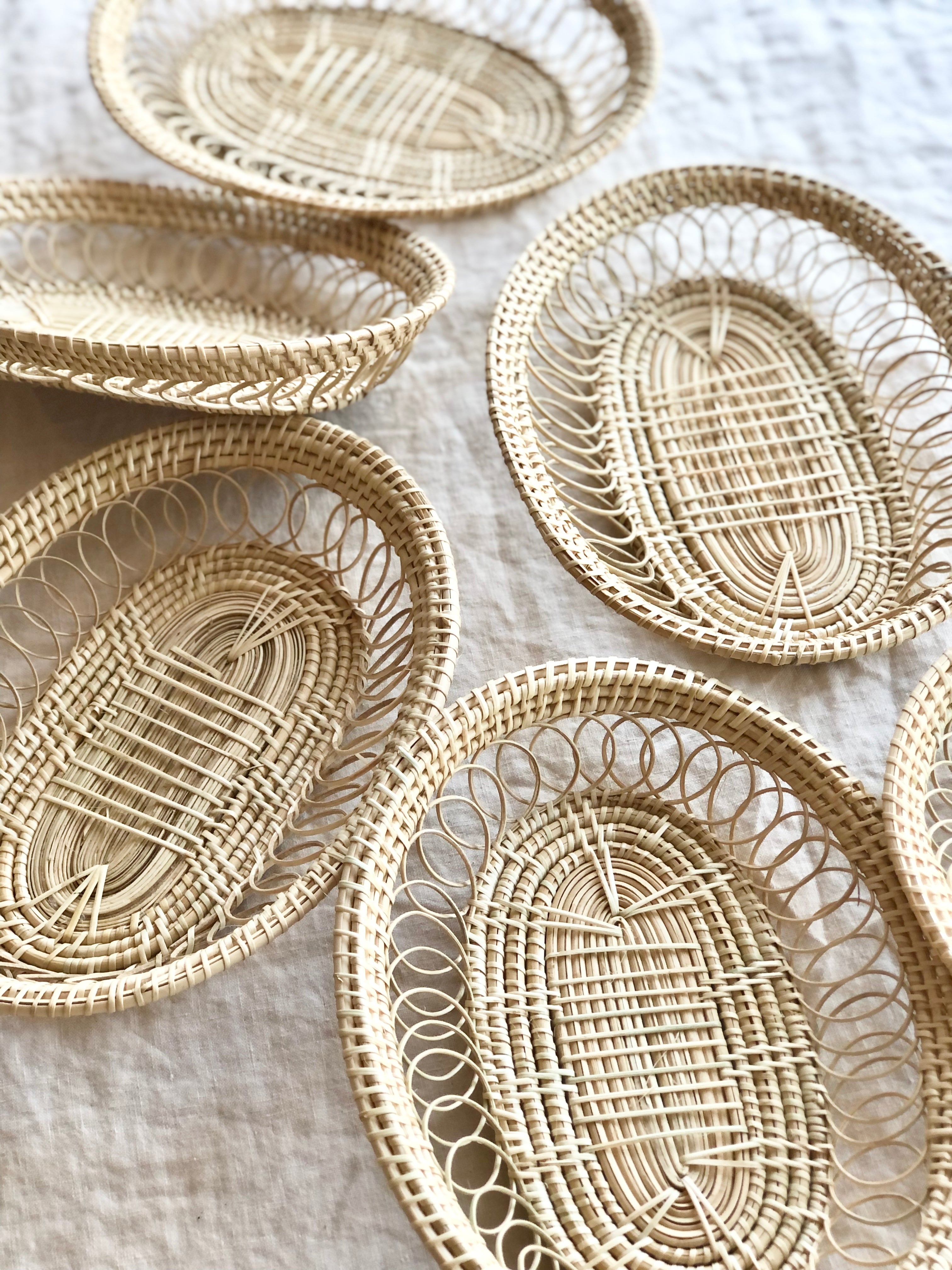 oval hand woven baskets on white table