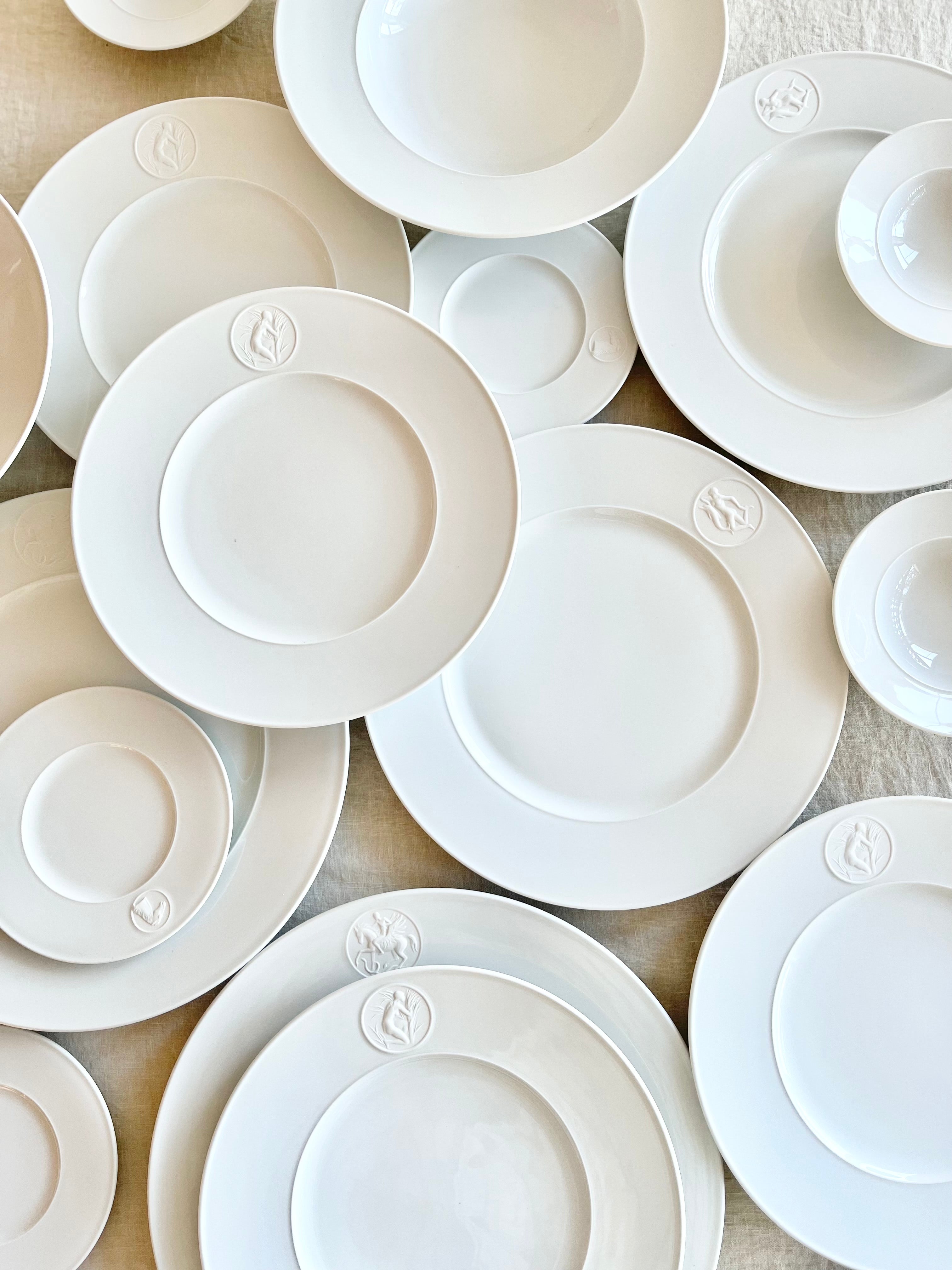 white salad plate with greek medallion design group of many