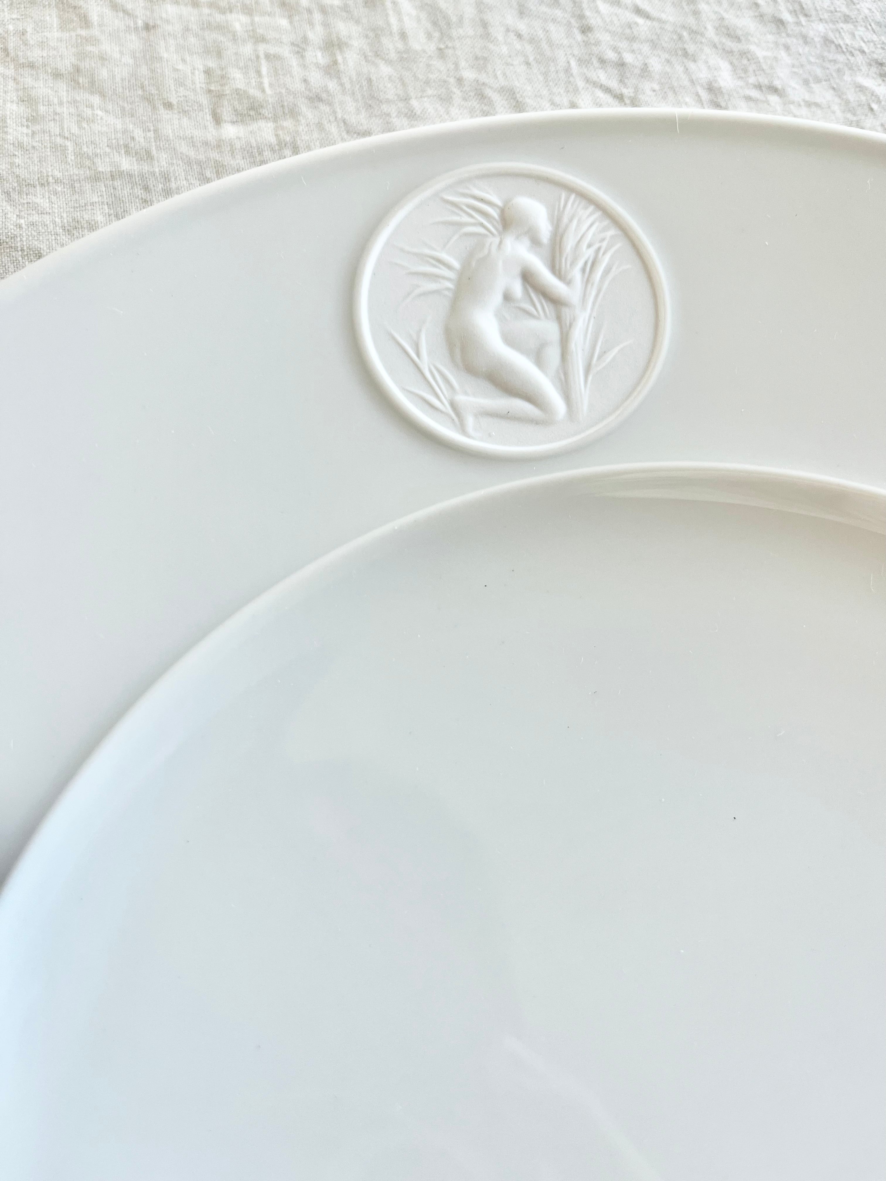 white dinner plate with detail view of greek medallion