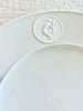 white dinner plate with detail view of greek medallion