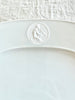 white oval serving platter with detail of greek god medallion